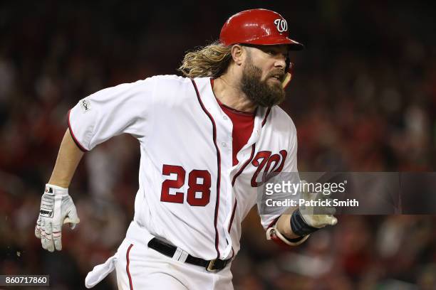 Jayson Werth of the Washington Nationals runs after hitting a single against the Chicago Cubs during the fourth inning in game five of the National...
