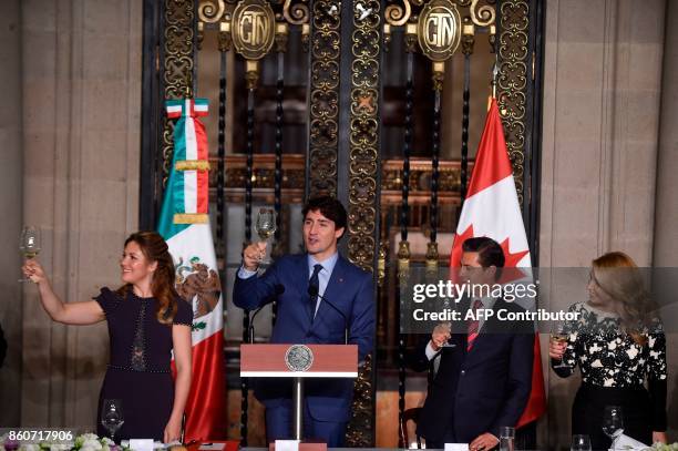 Canada's Prime Minister Justin Trudeau his wife Sophie Gregoire , Mexican President Enrique Pena Nieto and his wife Angelica Rivera, make a toast...