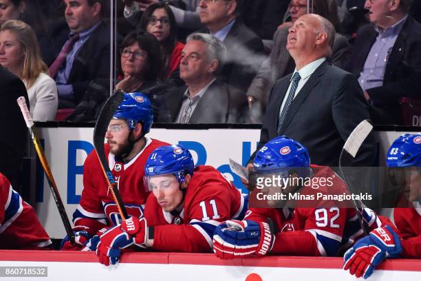 Head coach of the Montreal Canadiens Claude Julien looks up at the scoreboard against the Chicago Blackhawks during the NHL game at the Bell Centre...