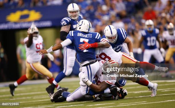 DeForest Buckner and Elvis Dumervil of the San Francisco 49ers sack Jacoby Brissett of the Indianapolis Colts during the game at Lucas Oil Stadium on...