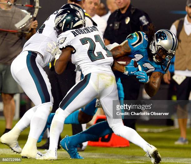 Carolina Panthers wide receiver Kelvin Benjamin stretches for extra yardage past Philadelphia Eagles defensive back Patrick Robinson in the first...