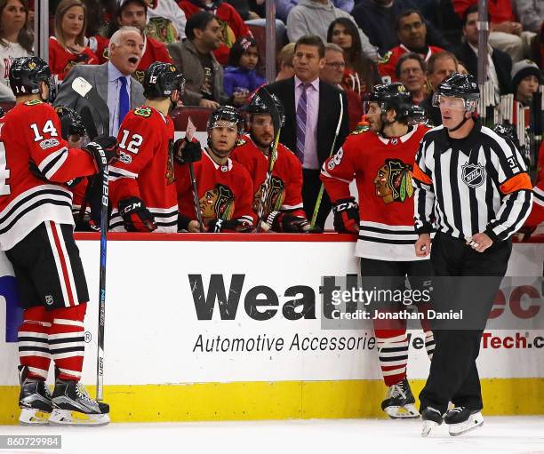 Head coach Joel Quenneville of the Chicago Blackhawks yells at referee Kevin Pollock during a game against the Minnesota Wild at the United Center on...