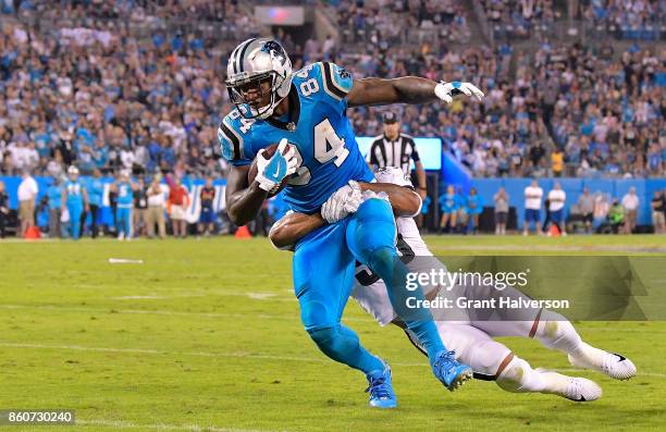 Ed Dickson of the Carolina Panthers runs the ball against Nigel Bradham of the Philadelphia Eagles in the fourth quarter during their game at Bank of...