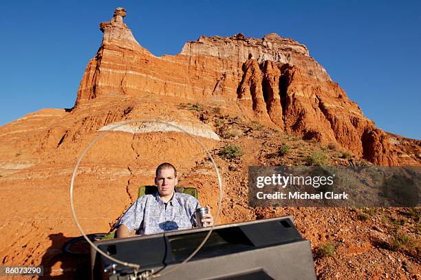 man in desert with television - remote control antenna stock pictures, royalty-free photos & images