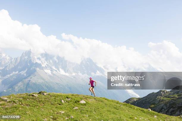 female cross country running in the mountains - chamonix train stock pictures, royalty-free photos & images