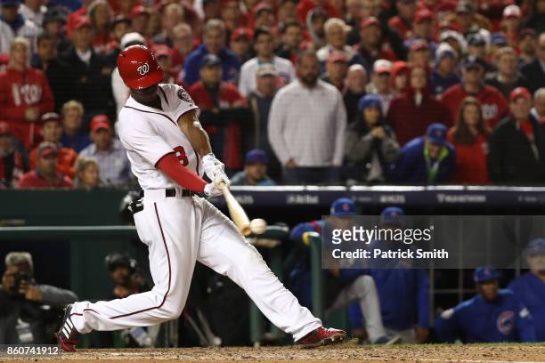 Michael A. Taylor of the Washington Nationals hits an RBI single against the Chicago Cubs during the eighth inning in game five of the National...