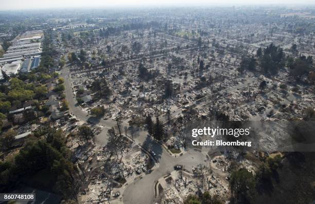 Residences burned by wildfires are seen in this aerial photograph taken above Santa Rosa, California, U.S., on Thursday, Oct. 12, 2017. Wildfires...