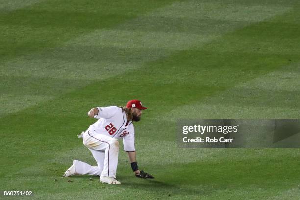 Jayson Werth of the Washington Nationals reacts after committing an error allowing a run to score against the Chicago Cubs during the sixth inning in...