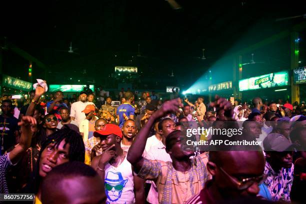 Afrobeat enthusiasts dance at the "Afrika Shrine" dedicated to the pioneer of Afrobeat, Fela Anikulapo Kuti, during the annual Felabration Musical...