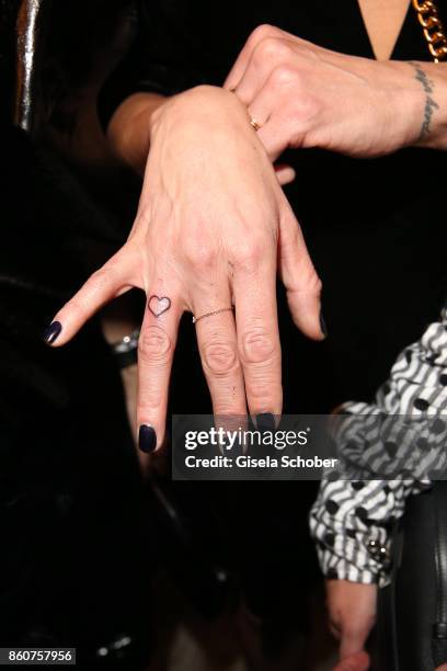 Lilly Becker's new tattoo heart on her finger during the grand opening of Roomers & IZAKAYA on October 12, 2017 in Munich, Germany.