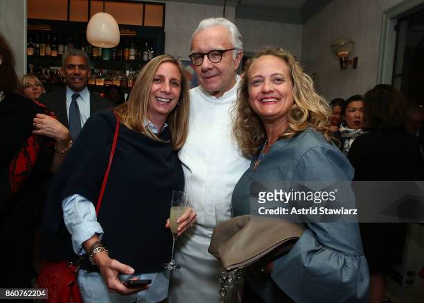 Chef Alain Ducasse poses for photos with guests during the celebration of women in the kitchen part of the Bank of America Dinner Series presented by...