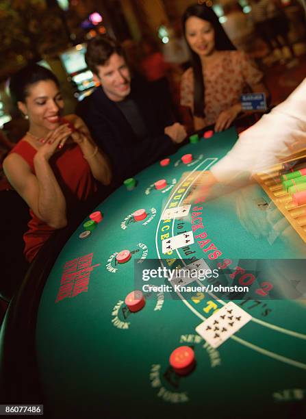 blackjack table at casino - casino tables hands stock pictures, royalty-free photos & images