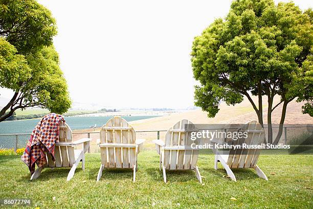 adirondack chairs and blanket - adirondack chair stock pictures, royalty-free photos & images