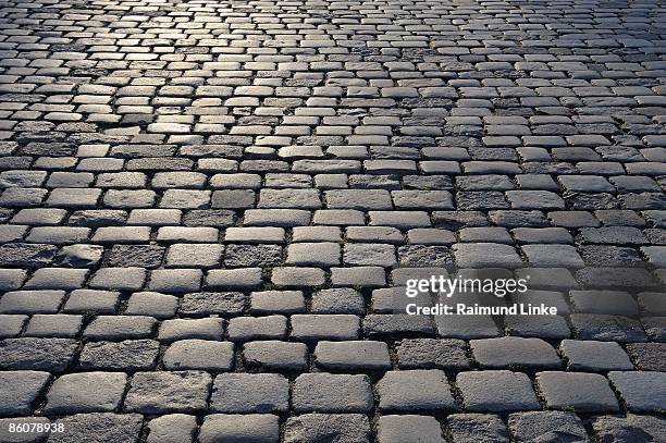 cobbled street - cobblestone texture stock pictures, royalty-free photos & images