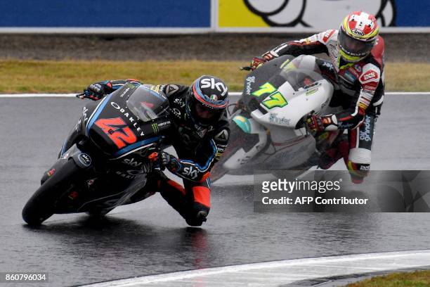 Kalex rider Francesco Bagnaia of Italy leads Suter rider Dominique Aegerter of Switzerlands during the Moto2-class second practice session of the...