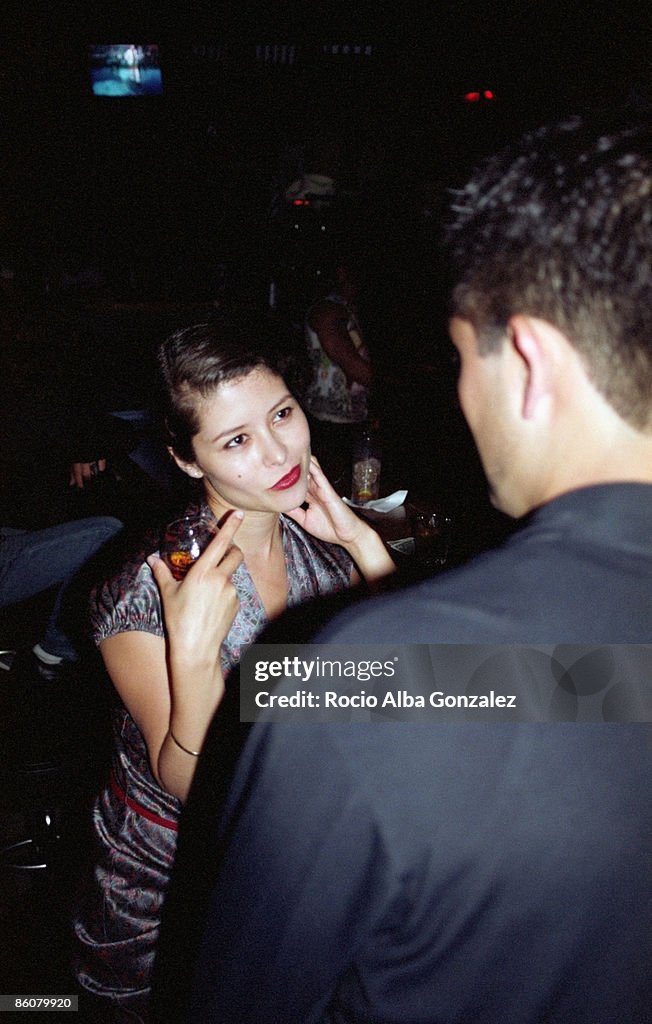 Woman flirting with man in bar