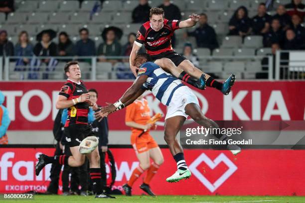Joe Ravouvou of Auckland goes for the high ball with Josh McKay of Canterbury during the round nine Mitre 10 Cup match between Auckland and...