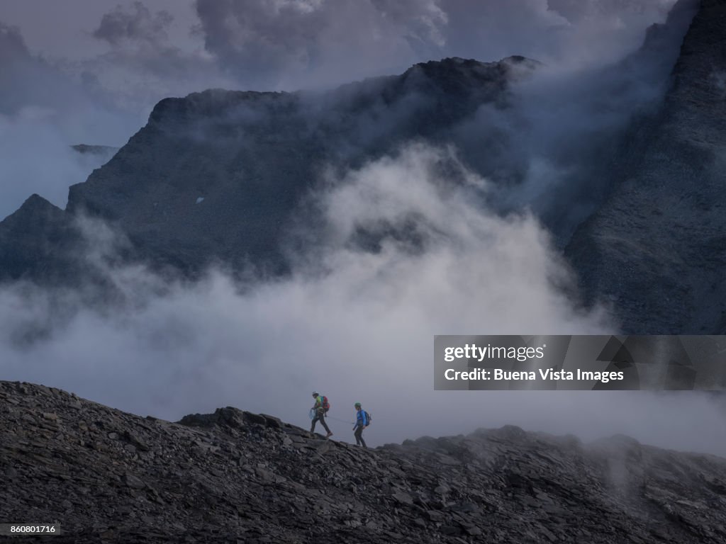 Couple of climbers on a rocky ridge