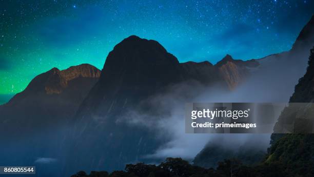the milford sound fiord. fiordland national park, new zealand with milky way - aurora australis stock pictures, royalty-free photos & images