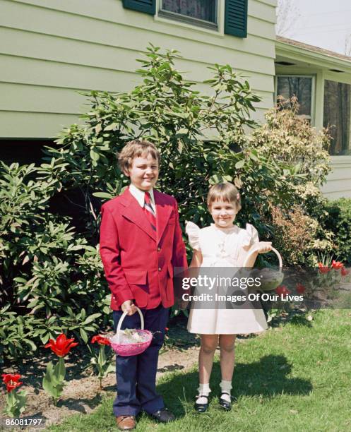 portrait of brother and sister holding easter baskets - old brother stock pictures, royalty-free photos & images