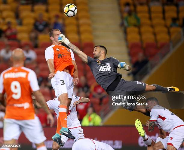 Luke De Vere of Brisbane and Paul Izzo of Adelaide clash during the round two A-League match between the Brisbane Roar and Adelaide United at Suncorp...