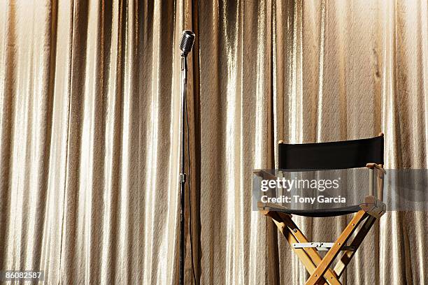 director's chair on stage - regisseurstoel stockfoto's en -beelden