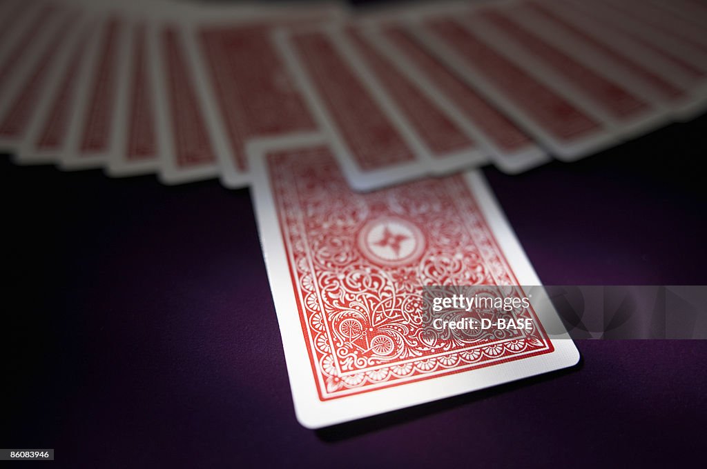 One card being pulled out of spead out