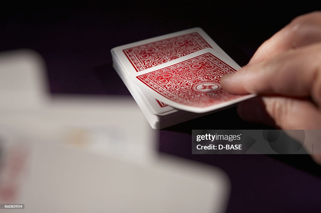 A man playing cards,