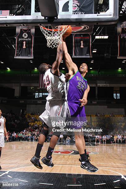 Carlos Wheeler of the Utah Flash blocks Richard Hendrix of the Dakota Wizards during the second round of the D-League Playoffs on April 20, 2009 at...