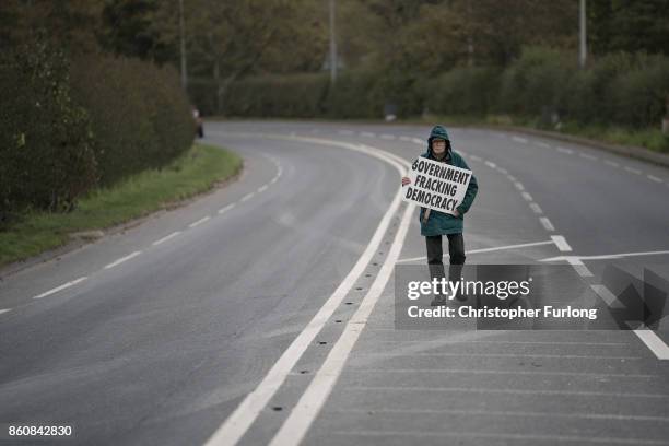 Lone protestor demonstrates outside Workmen Cuadrilla's shale gas fracking drilling rig near Westby on October 12, 2017 in Blackpool, England....