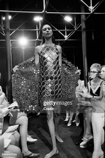 Picture taken in March 1968 of a model presenting a metal dress by Spanish designer Paco Rabanne during a fashion show, in Paris.