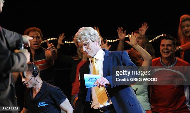 David Wenham performs the role of "Jerry Springer" during a rehearsal for "Jerry Springer The Opera" at the Sydney Opera House on April 21, 2009....