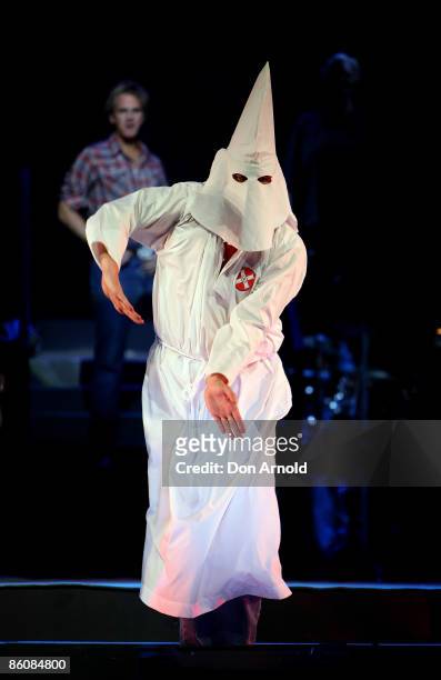 Ensemble cast play dancing klansmen during the 'Jerry Springer The Opera' photo call at the Sydney Opera House on April 21, 2009 in Sydney, Australia.