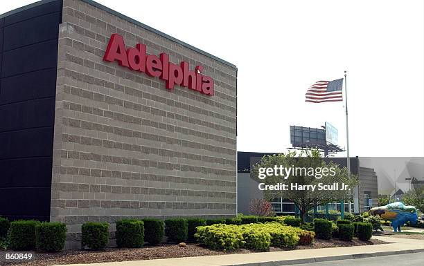 Flag flies in front of the Adelphia Communications building June 26, 2002 in Buffalo, New York. Adelphia filed for Chapter 11 bankruptcy protection...