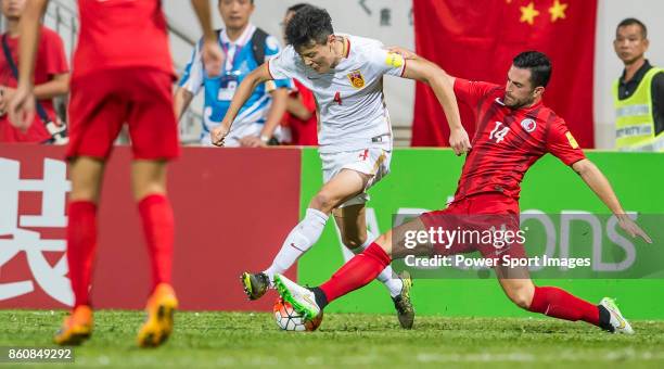 Zou Zheng of China PR fights for the ball with Jonathan Sealy of Hong Kong during their FIFA World Cup Qualifiers 2015 match between Hong Kong and...