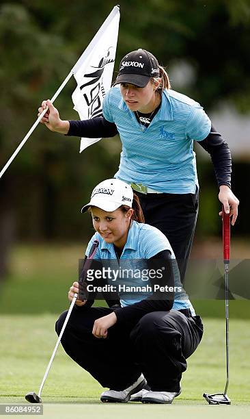 Caroline Bon of Northland and Larissa Eruera of Aviation line up a putt on the ninth hole during the New Zealand Women's Amateur Championship at...