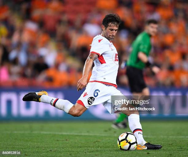 Vince Lia of Adelaide United kicks the ball during the round two A-League match between the Brisbane Roar and Adelaide United at Suncorp Stadium on...