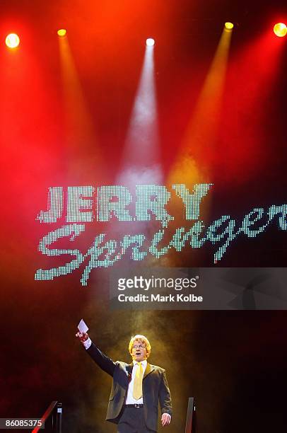 Actor David Wenham who plays Jerry Springer arrives on stage during the "Jerry Springer: The Opera" photocall at the Sydney Opera House in Sydney,...