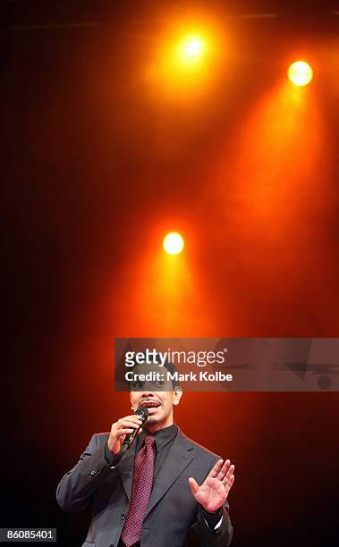 Actor David Bedella who plays the warm-up man sings during the "Jerry Springer: The Opera" photocall at the Sydney Opera House in Sydney, Australia.