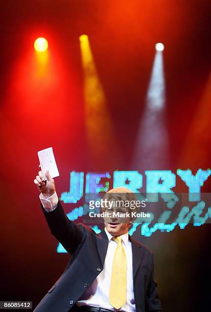 David Wenham who plays Jerry Springer arrives on stage during the "Jerry Springer: The Opera" photocall at the Sydney Opera House in Sydney, Australia