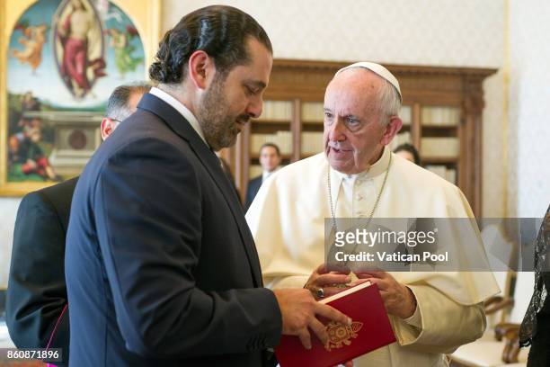 Pope Francis exchanges gifts with Lebanon Prime Minister Saad Hariri during a private audience at the Apostolic Palace on October 13, 2017 in Vatican...