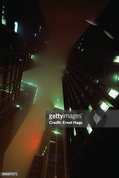 Skyscrapers rise through the fog in New York City, 1980.