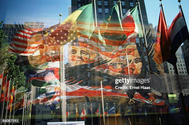 Painting of Mount Rushmore and an American Eagle, combined with a reflection in a window of the Rockefeller Centre and the various flags outside the...