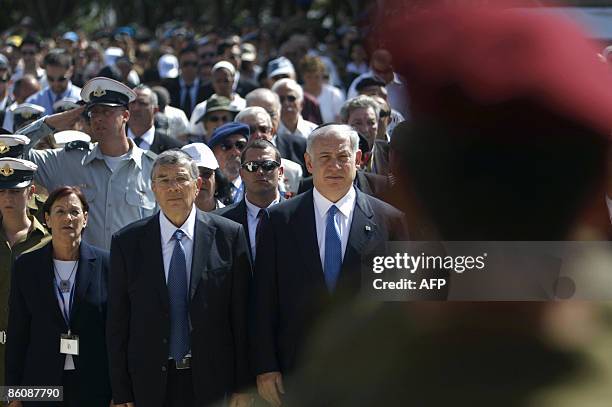 Israel's Prime Minister Benjamin Netanyahu and Avner Shalev , chairman of Yad Vashem, stand still during a ceremony at Yad Vashem Holocaust Memorial...