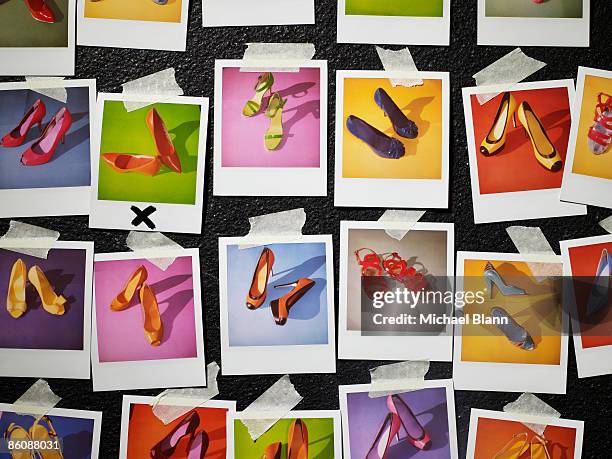 polaroids of shoes taped to wall - fashion photography stockfoto's en -beelden