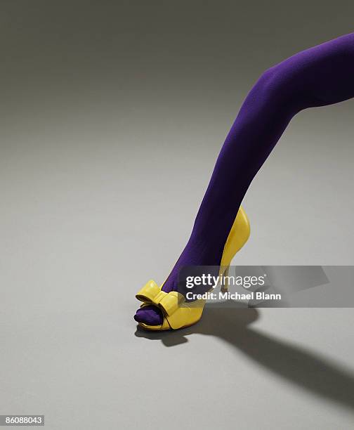 woman's arm in a shoe - beautiful legs and feet fotografías e imágenes de stock