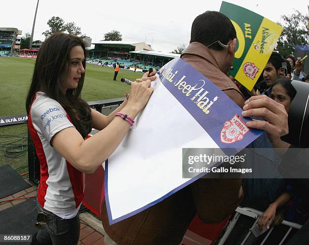 Preity Zinta signs autographs during the IPL T20 match between Kings XI Punjab v Kolkata Knight Riders at Sahara Park on April 21, 2009 in Durban,...