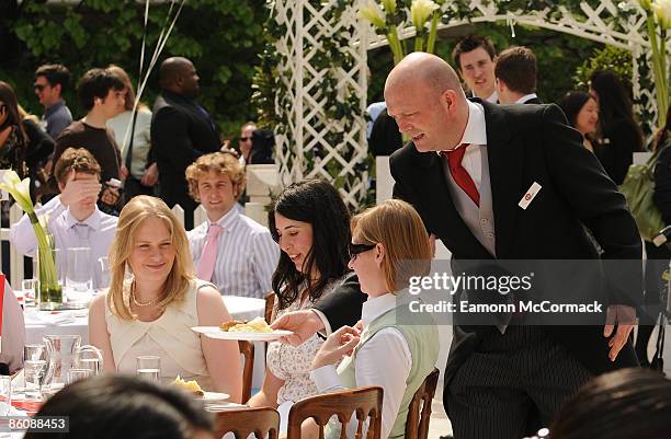 City workers enjoy a free lunch at the relaunch of the internet search engine Jeeves to Ask Jeeves at Broadgate Circle on April 21, 2009 in London,...