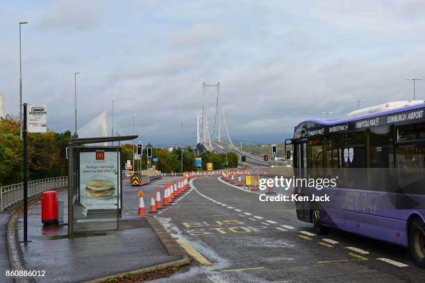 Bus approaches the old Forth Road Bridge as a phased re-opening to some scheduled bus services begins, on October 13, 2017 in South Queensferry,...