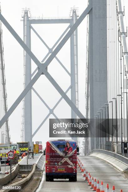 Bus crosses the old Forth Road Bridge as a phased re-opening to some scheduled bus services begins, on October 13, 2017 in South Queensferry,...
